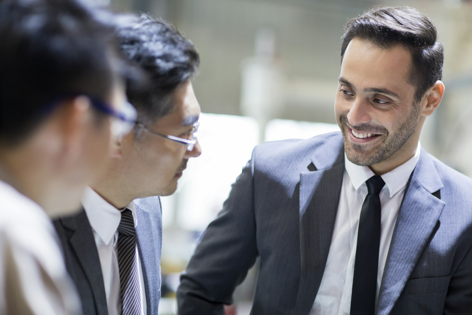 Businessmen and engineers talking in the factory